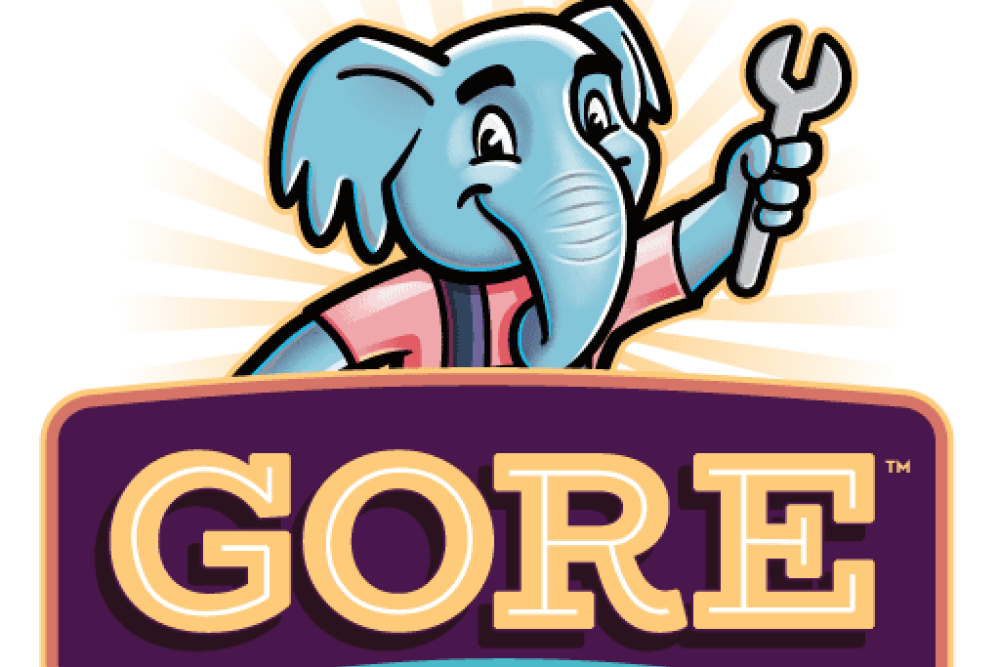Elephant mascot holding a wrench for Gore Plumbing, Heating, Air logo.